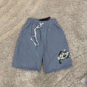 Amiri Blue Washed Flared AM Filigree Logo Shorts